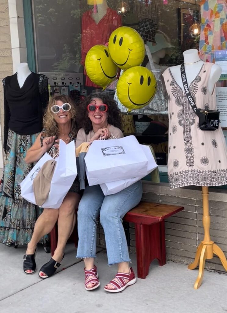 Julie Cohen with store manager in front of her fashion-forward boutique Hubba-Hubba.