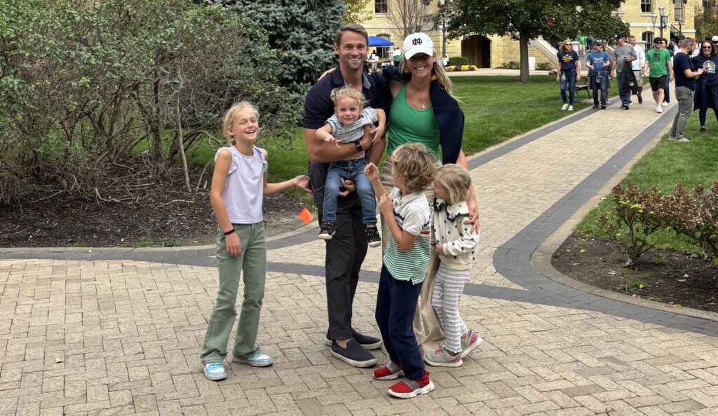 Meet a Mom: Meet Ellen Castellini, Needlepoint Guru and Founder of Ellen Elizabeth Stitches! Posing in this photo is Ellen with her husband and four children.