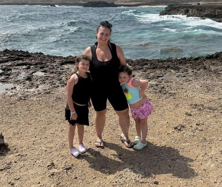 A mother with two young daughters enjoying a day at Ocean City beach, Maryland.