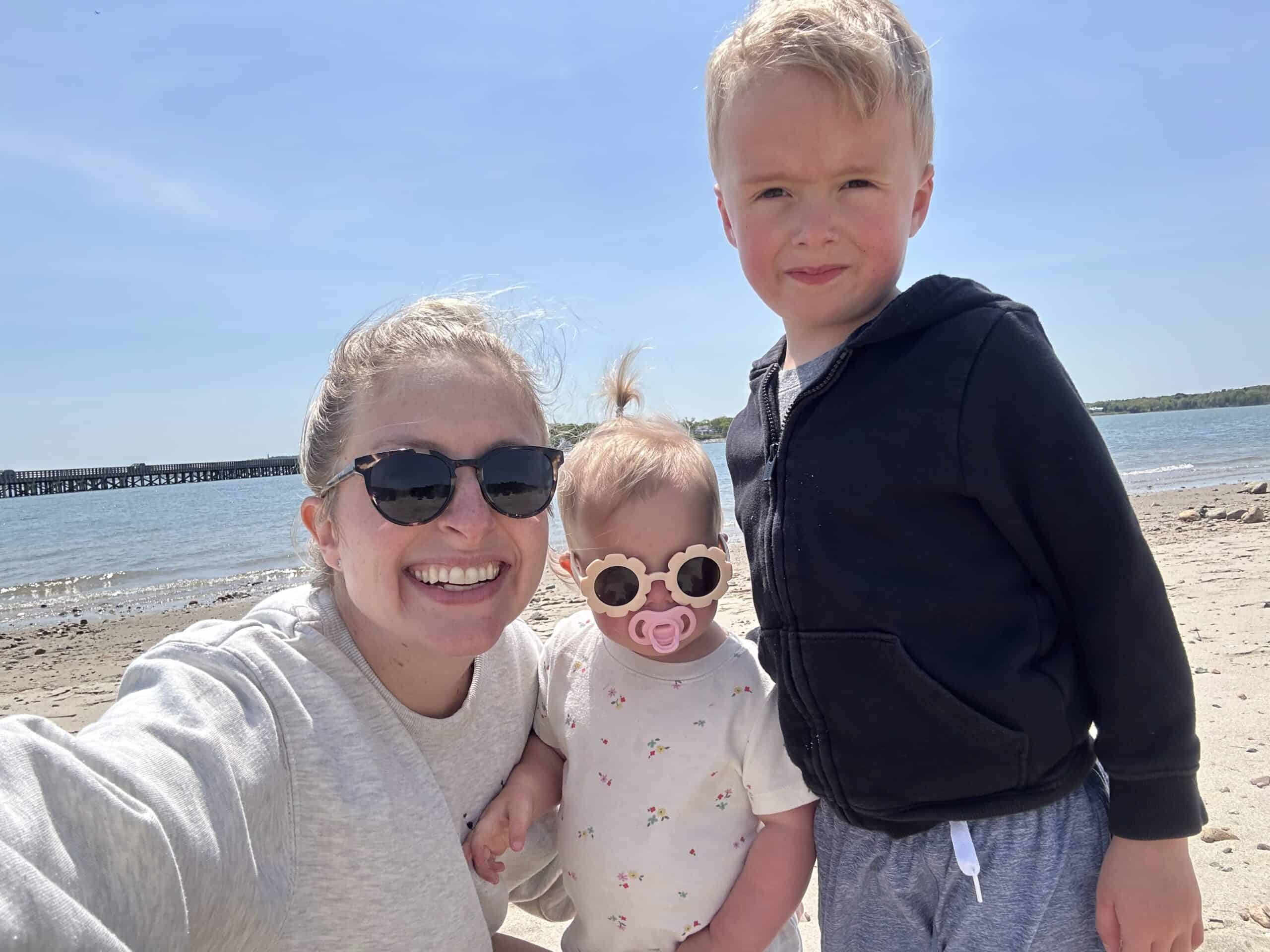 A happy family enjoying a day at Ocean City beach with kids in sunny weather.