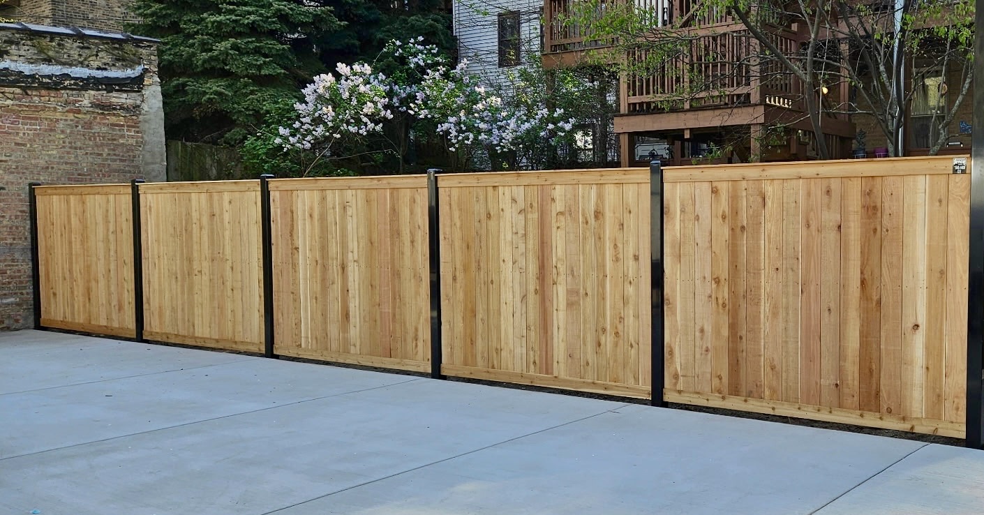 wood fence professionally installed in a residential backyard