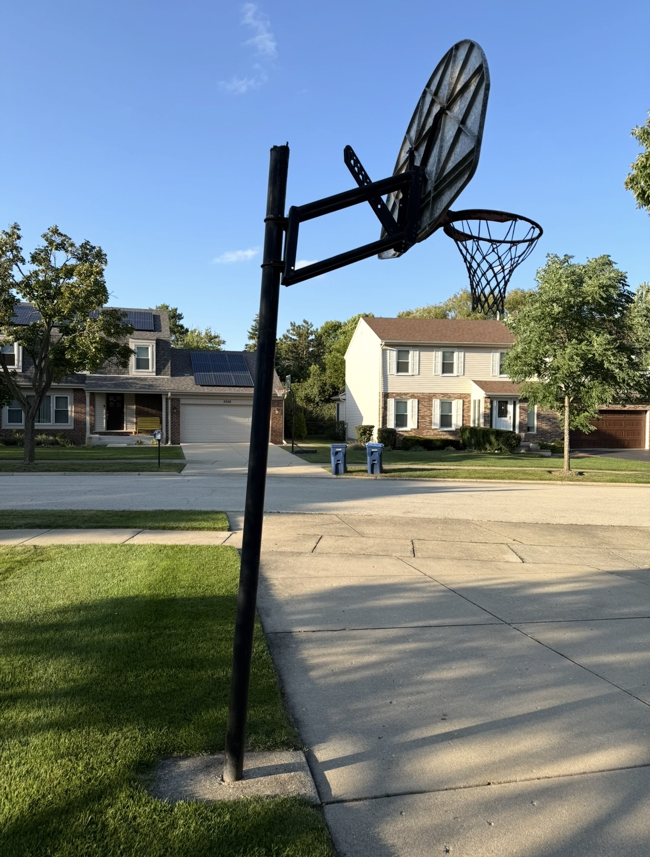 Worn portable basketball hoop with a leaning pole