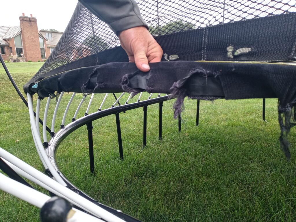 torn trampoline safety pad showing wear and tear