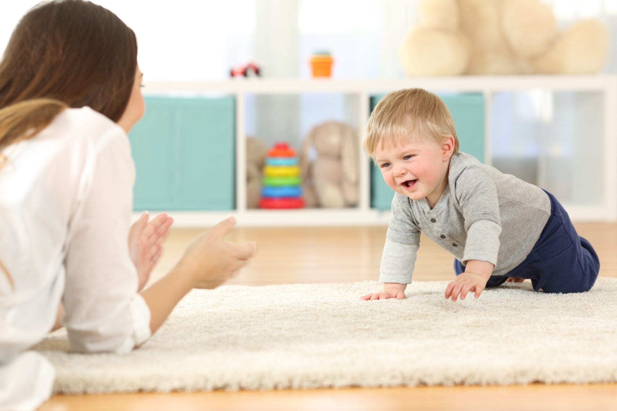 Baby crawling towards his mother